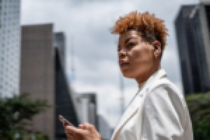 Mid adult woman walking along the financial district