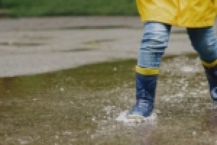 funny-kids-rain-boots-playing-with-paper-ship-by-puddle-150x150-1